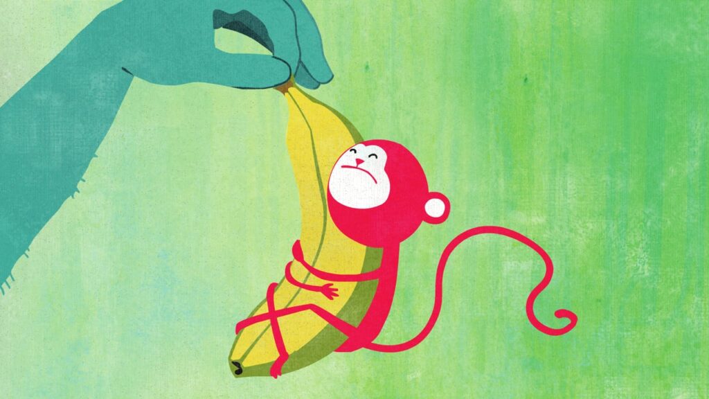 a monkey hugging a banana 