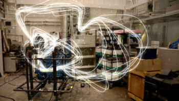 Sparks fly in a room full of semiconductor equipment