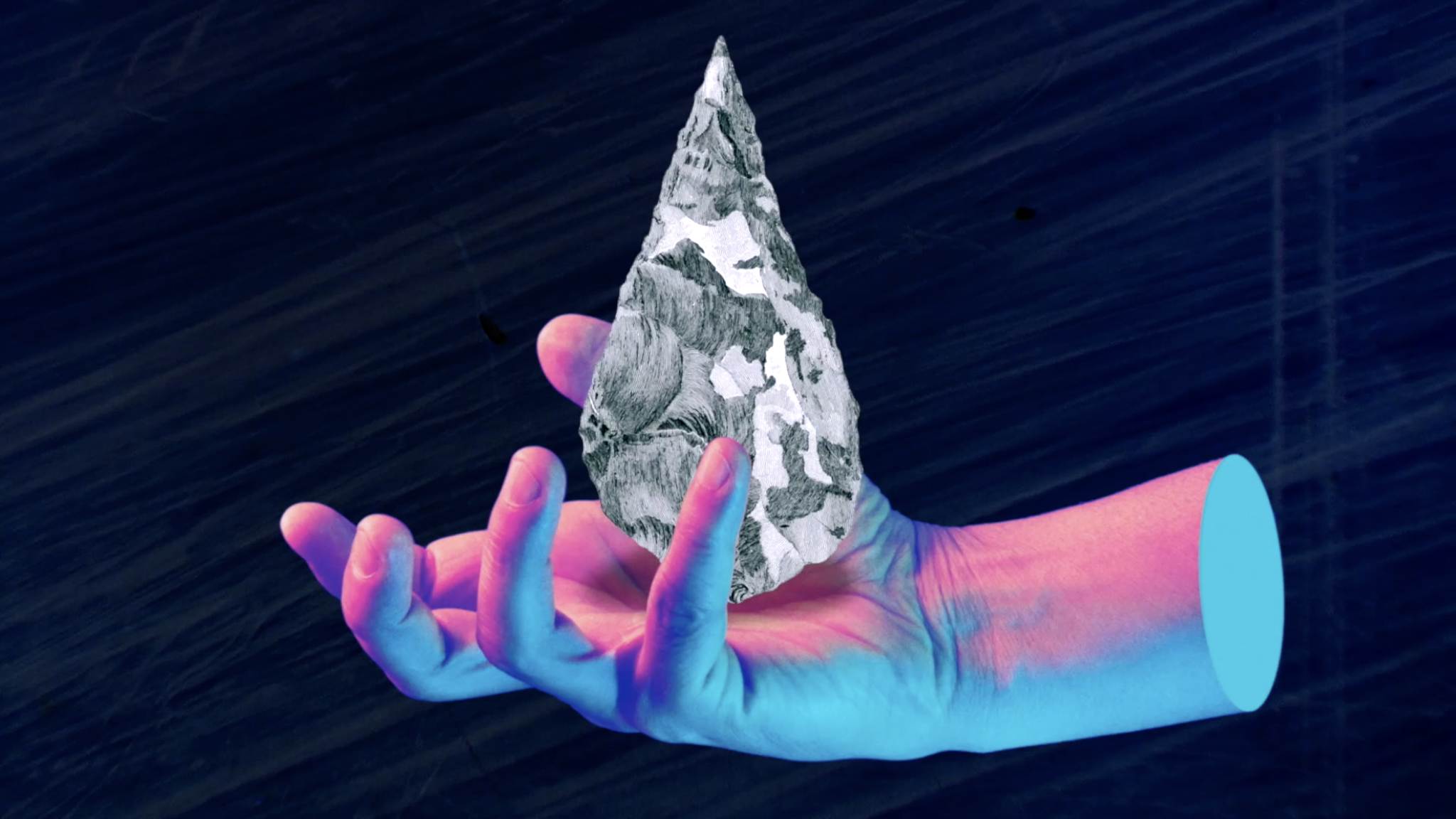 A disembodied hand clutches a piece of flint.