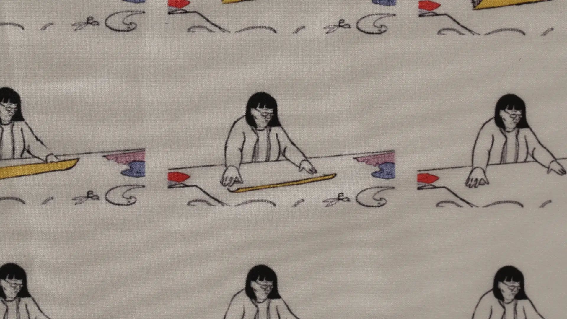 Repeated ink drawing of a woman cutting out cloth, printed on to cloth.